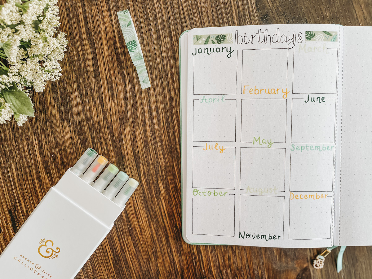 how to start a bullet journal with a birthday tracker page and calligraphy pens